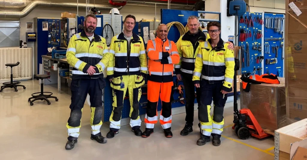 Jotun engineering maintenance team with Mount Filling Systems visitor in Sandefjord workshop